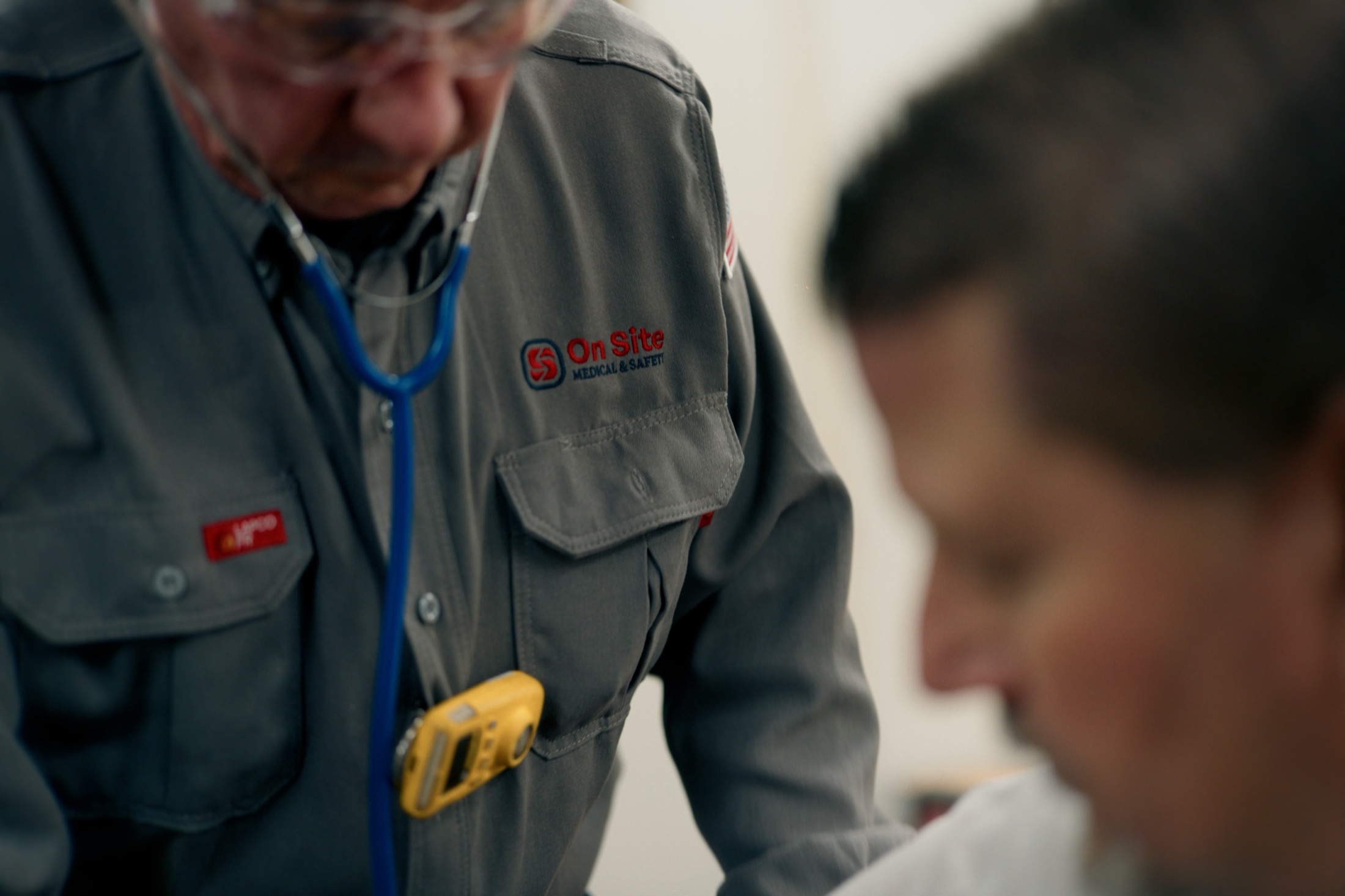 On Site Medical & Safety — logo embroidered on a field shirt during a rig assessment